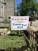An elect Harris/Walz yard sign in a front yard